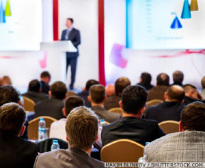 Speaker and delegates at a conference